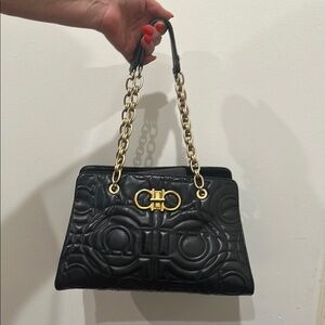 Elegant Black Quilted Handbag with Gold Chain